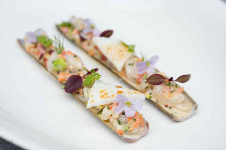 Tom-Kitchin-Razorclams-Razor-clams-from-the-Isle-of-Barra-cooked-to-order-and-served-with-diced-vegetables-chorizo-and-wild-herbs-copy.jpg