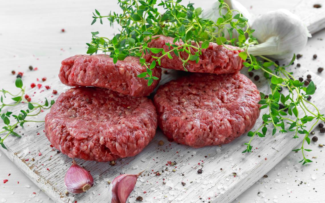 Home HandMade Raw Minced Beef steak burgers on wooden board.jpeg